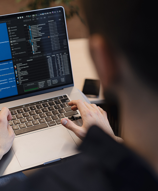 Man working on computer. Young it worker using laptop in the office, Internet marketing, technology, finance, business concept